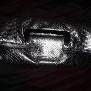 Beautiful preowned metallic silver clutch